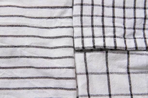 istock Plaid material. Towel on the table. Wrinkled fabric with stripes. 1382007835