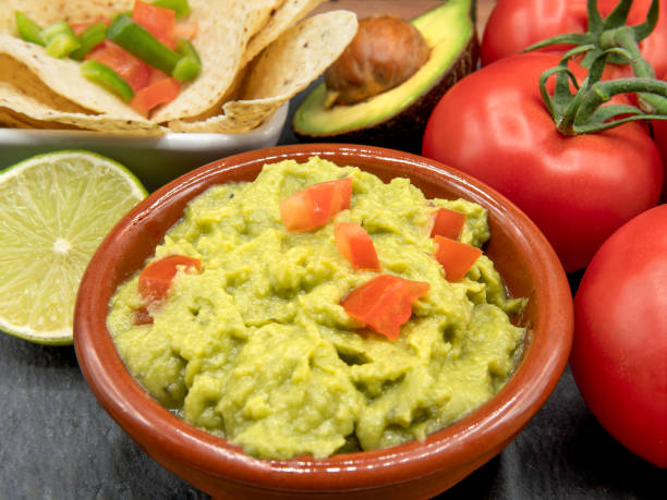 istock Homemade Organic Guacamole, tomatoes and Tortilla Chips. Selective focus. 1382007964