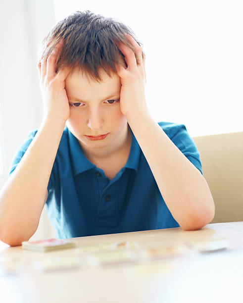 istock Upset little guy losing a card game 138203251