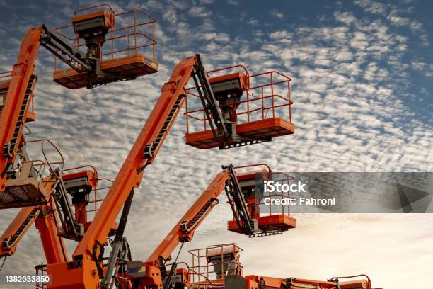 Articulated Boom Lift Aerial Platform Lift Telescopic Boom Lift Against Blue Sky Mobile Construction Crane For Rent And Sale Maintenance And Repair Hydraulic Boom Lift Service Crane Dealership Stock Photo - Download Image Now