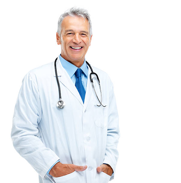 Happy healthcare practitioner Portrait of happy mature medical doctor standing against white background lab coat photos stock pictures, royalty-free photos & images