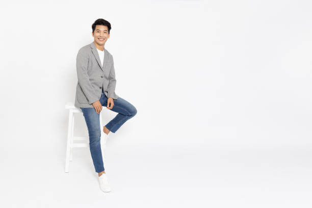 happy young asian startup businessman standing and smiling in white studio isolated background, full body composition - businessman business arms crossed business person imagens e fotografias de stock