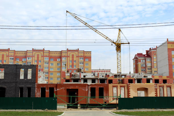 istock Ordinary building in an ordinary city with a crane 1382051909