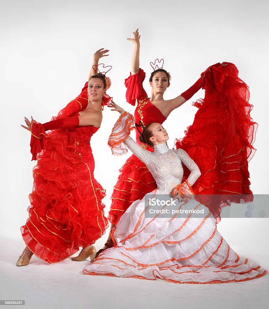 Three young women dancing flamenco Three young women dancing flamenco in studio Dancing Stock Photo