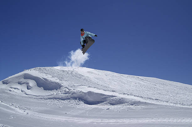 istock Snowboarder jumping in terrain park 138205623