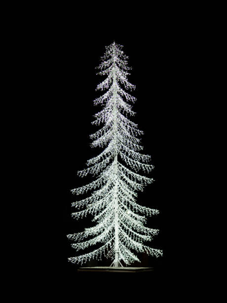 istock white tree made of lights on a black background 1382077005