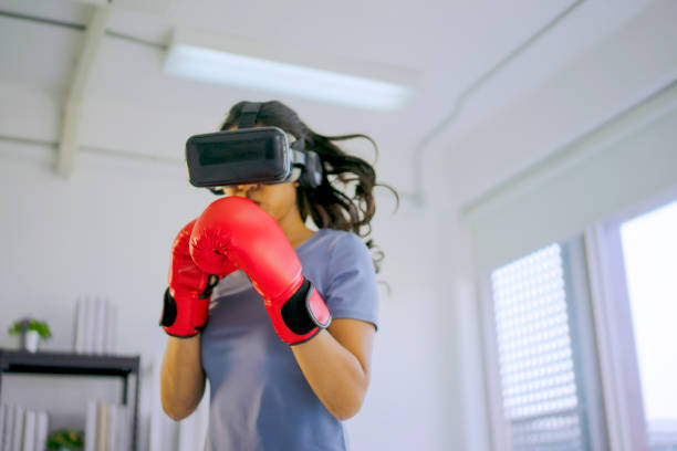 Young woman is exercise with virtual reality glasses.