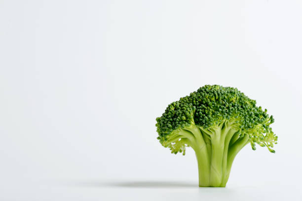 istock Close up shot of a sliced broccoli on a white background. 1382088959