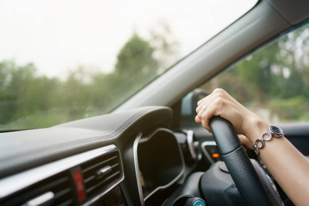 istock Woman driving a car. 1382092233