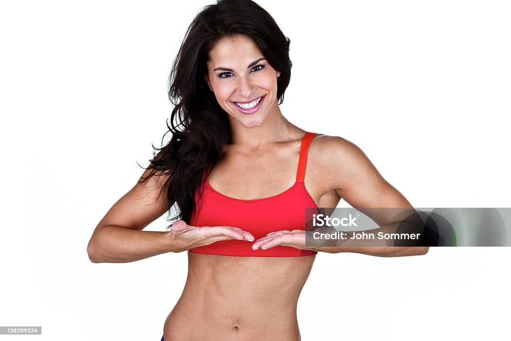 Fit woman holding hands for product placement Woman in perfect physical condition holding her hands for product placement  20-24 Years Stock Photo