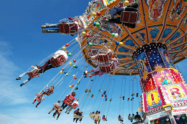 Families at the fair on a swing ride chairoplane at the Beer Fest in munich amusement park ride photos stock pictures, royalty-free photos & images