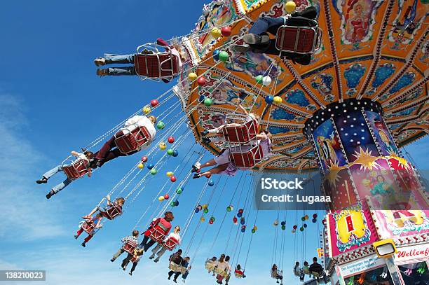 Families At The Fair On A Swing Ride Stock Photo - Download Image Now - Amusement Park, Family, Oktoberfest