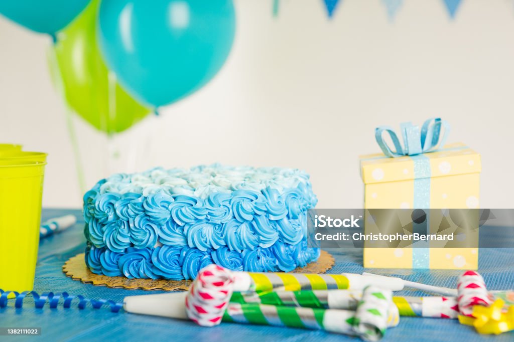 Blue birthday cake Blue birthday cake and decoration on table Birthday Stock Photo