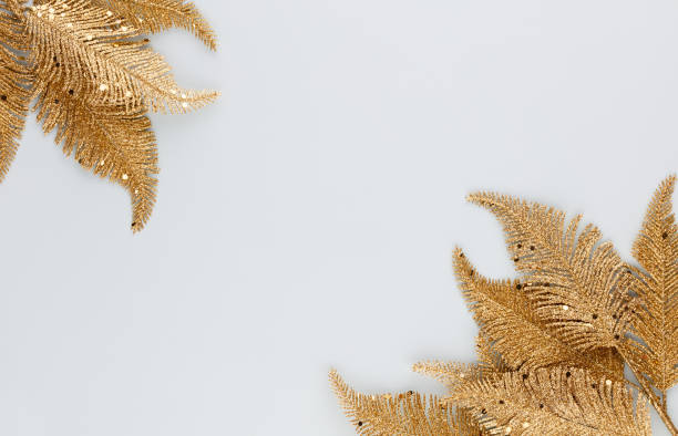 istock Palm gold leaf on blue background. Palm leaf, Flat lay and top view. 1382121723