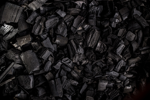 Charcoal texture black background top view copy space