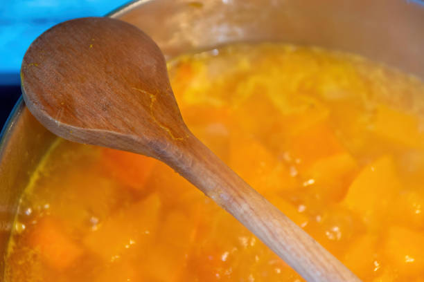 istock a wooden cooking spoon over a pumpkin stew 1382131977