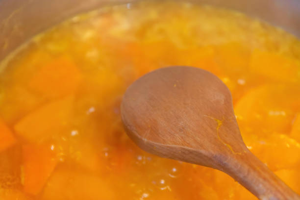 istock a wooden cooking spoon over a pumpkin stew 1382132483