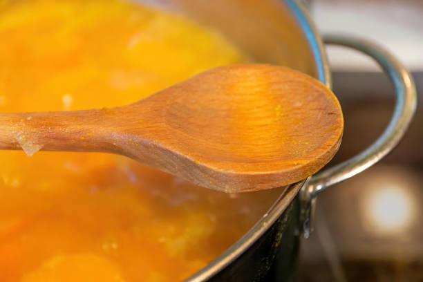 istock a wooden cooking spoon over a pumpkin stew 1382133016