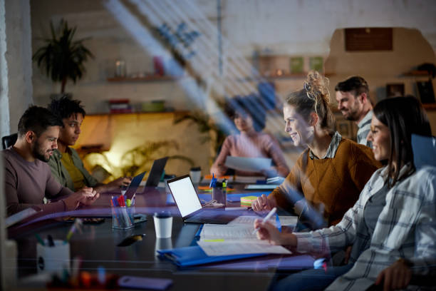 istock Happy multi-tasking freelancers working late in the office. 1382141239