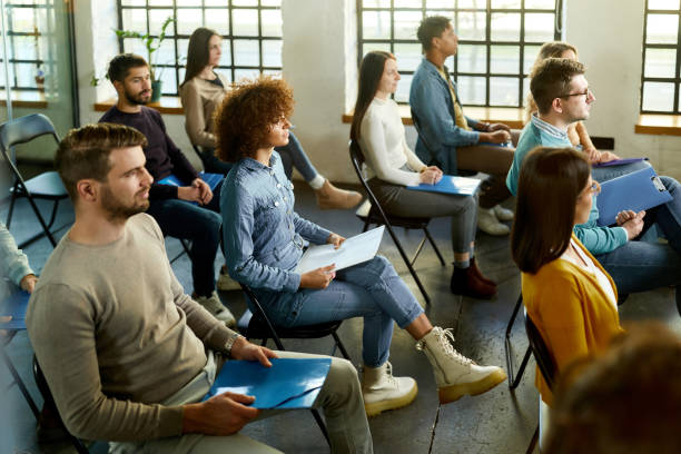 istock Young freelancers having a seminar in board room. 1382144408