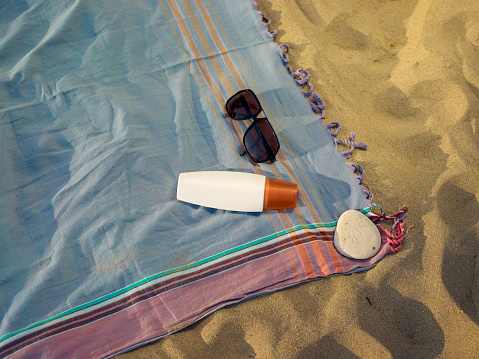 Beach towel and sun glasses