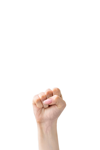 Protest fist. Solidarity gesture. Revolution power. Rebellion freedom. Female raised clenched hand striking isolated on white copy space background.