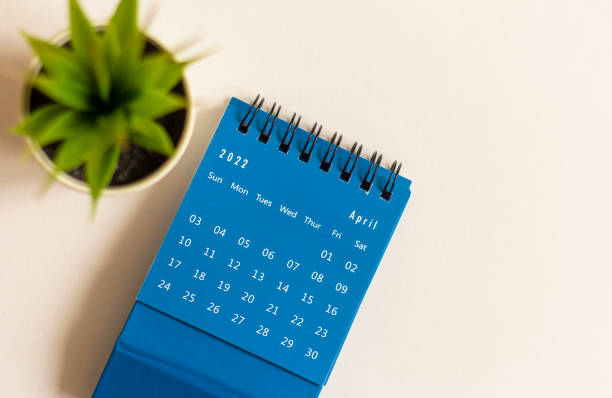 istock Desktop calendar for April 2022 for planning on a white background. 1382160547