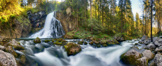 istock Waterfall in Austria - forest landscape with stream 1382161126