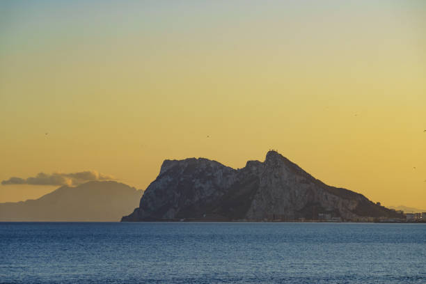 Seascape with Gibraltar rock on horizon. View from Torrecarbonera beach, Punta Mala, Andalusia Spain.