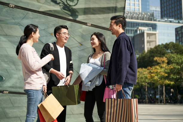 istock group of young asian people talking chatting conversing during shopping trip 1382168105