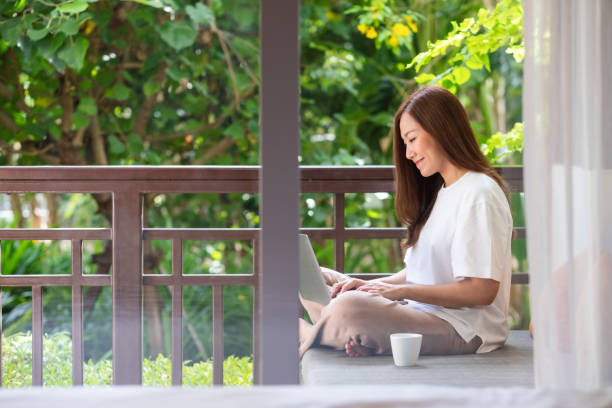 istock Portrait image of a young woman using laptop computer for working or studying online at home 1382186723