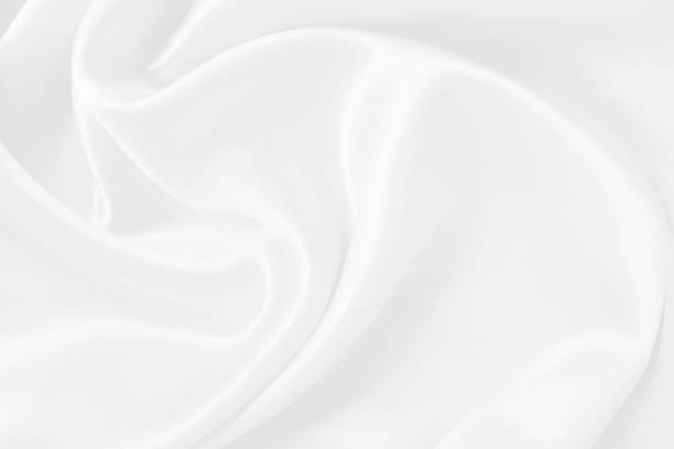 istock White fabric texture background, detail of silk or linen pattern. 1382187513