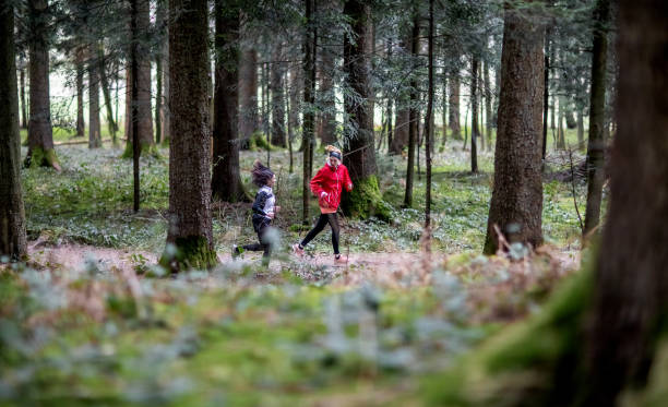 istock Two friends exercising in the woods 1382187914