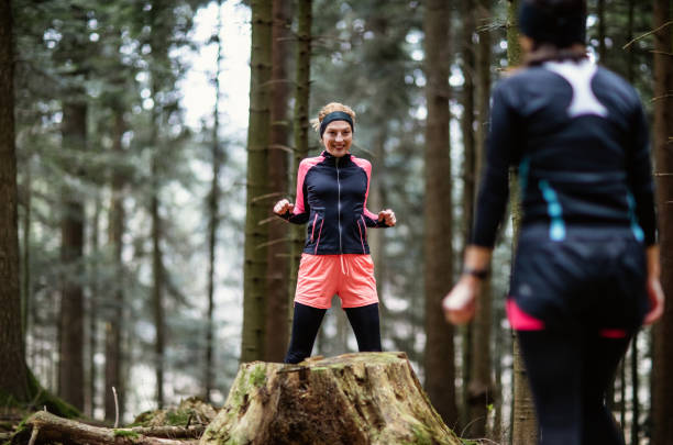 istock Two friends exercising in the forest 1382187957