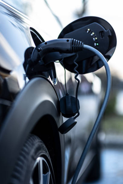 Electric Car Charging At Power Station stock photo