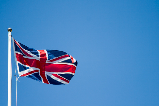 Union Jack flag flying in the wind with copy space