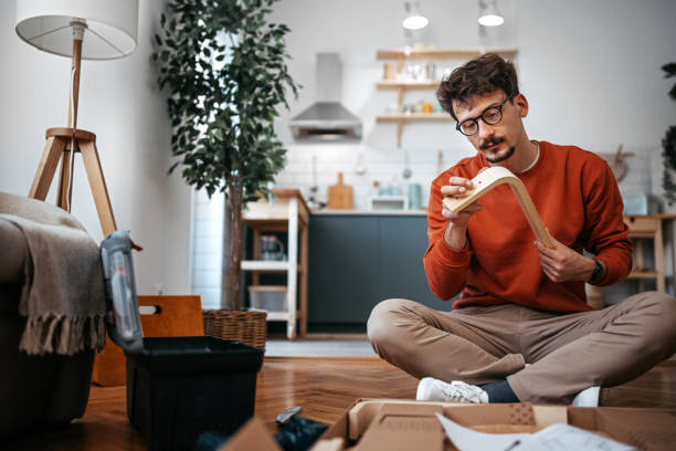 istock Young man examining table parts at home 1382202227