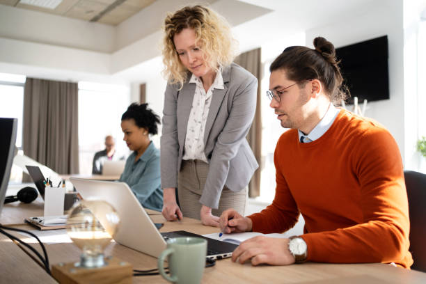 istock Business team working together at the open space office 1382204833