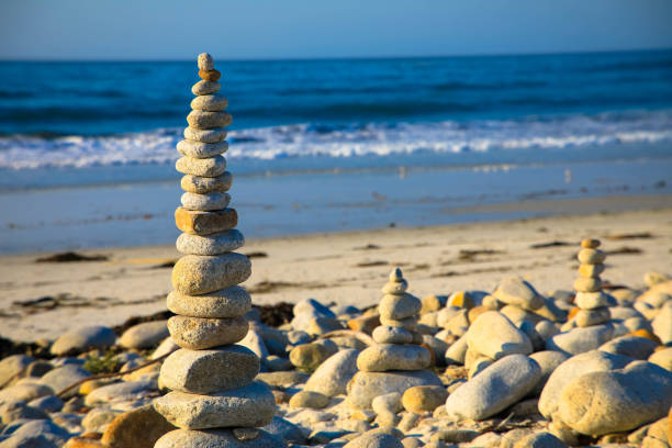 istock Stack of zen stones on pebble beach. Beach landscape. 1382205580
