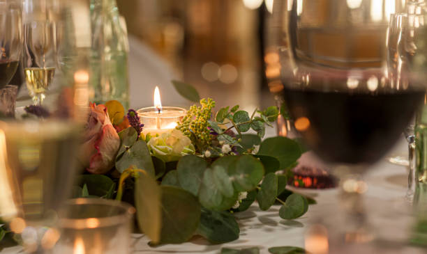 istock decoration with a lighted candle between wine glasses 1382207291