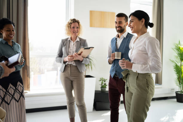 istock During coffee break at the office, multiracial coworkers having a casual conversation 1382208916