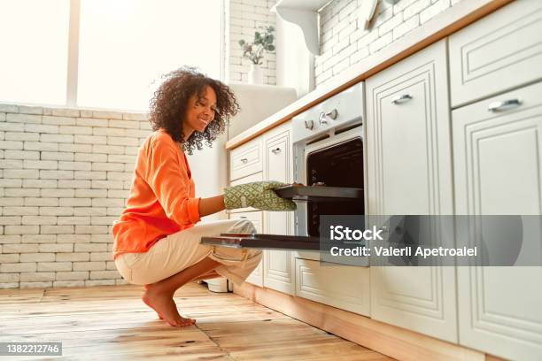 African American Family At Home Stock Photo - Download Image Now - Oven, Women, Opening