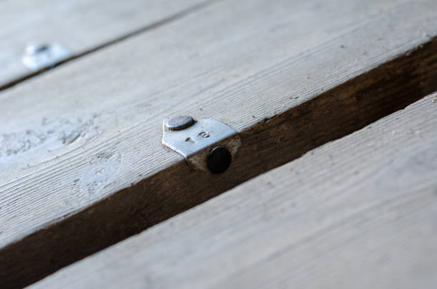 istock Number 18 tag on old board. Dirty board with aluminum tag. 1382226624