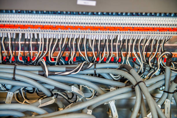 istock Organized tidy and not messy electronic signal processing wires in a science lab. Many connected cables in sockets. 1382226721