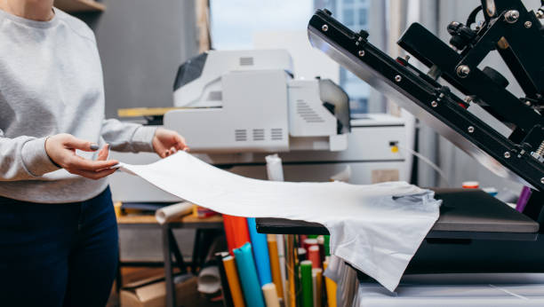 Desktop thermo press for printing images on fabric.