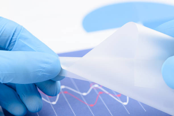 istock Flexible semitransparent plastic like material in scientist hands 1382237936