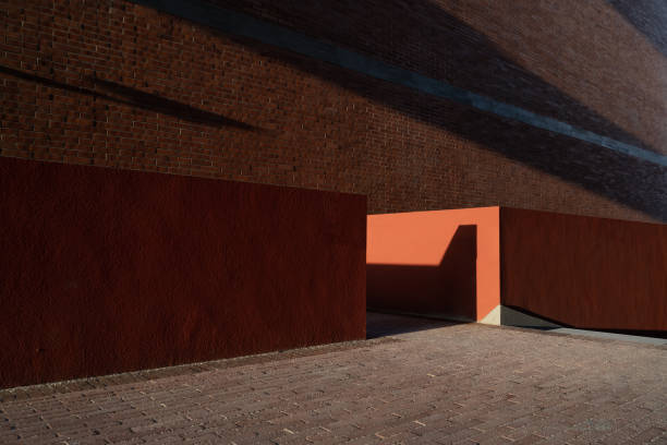 The corner of a colorful modern building with the effect of light and shadow