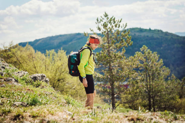 istock Young caucasian man trekking in the mountain. 1382250031