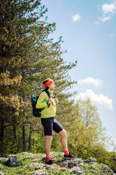 istock Young caucasian man trekking in the mountain. 1382250034