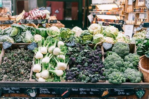 Color image depicting beautiful fresh fruit and vegetable on display at a market stall at Borough Market, London, UK. It is one of the oldest and most popular food markets in the world. Room for copy space.